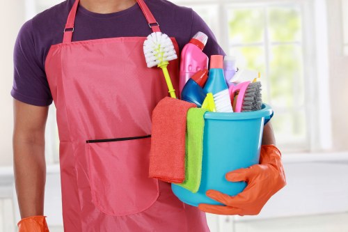 Professional carpet cleaner in E3 removing dirt from a living room carpet
